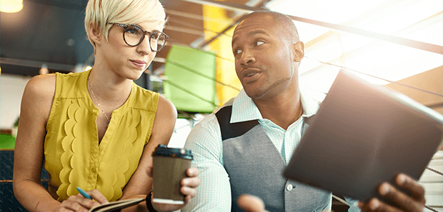 Employees looking at tablet